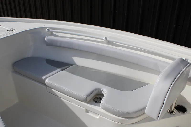 Slide: The Image of 2025 Mako 214 Center Console boat with cushioned seating and sleek design. - 9