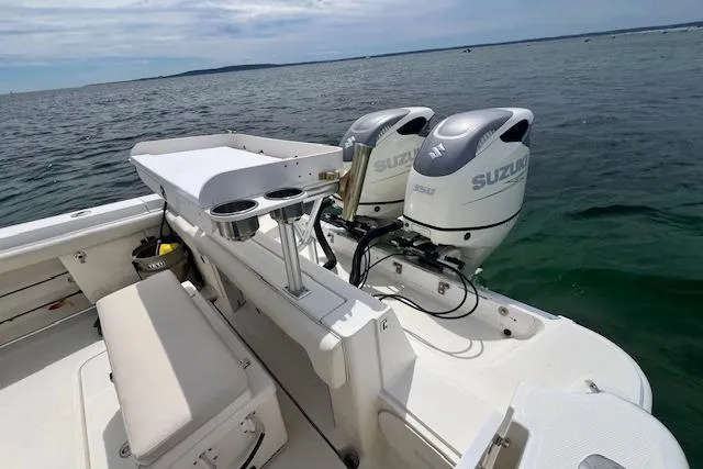 Slide: The Image of 2005 Hydra-Sports Vector 3300 CC boat with dual Suzuki outboard engines on open water. - 14