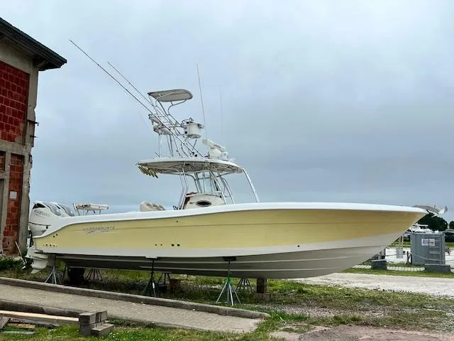 Slide: The Image of 2005 Hydra-Sports Vector 3300 CC boat on stands, side view, overcast sky. - 4