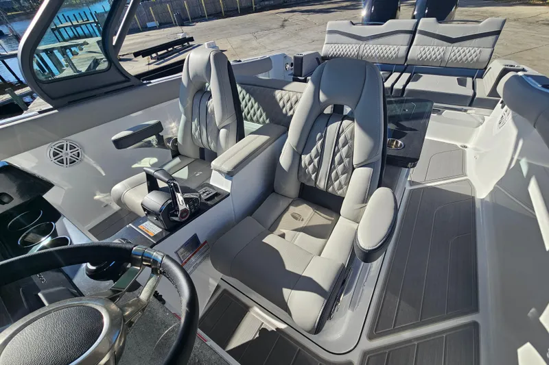 Slide: The Image of 2026 Monterey Elite 30 OB boat interior with luxurious seating and modern controls. - 19