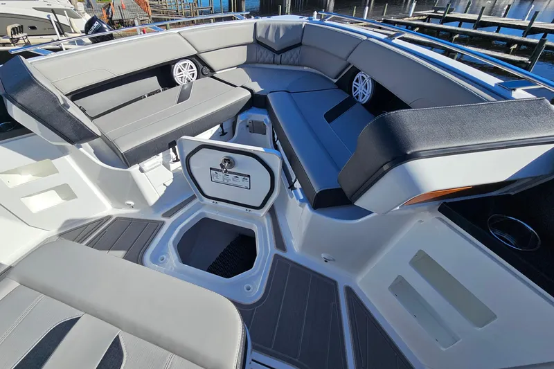 Slide: The Image of 2026 Monterey Elite 30 OB boat interior with spacious seating and storage compartments. - 23