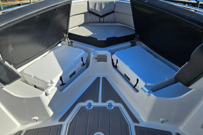 Slide: The Image of 2026 Monterey Elite 30 OB boat interior with seating and storage compartments. - 24