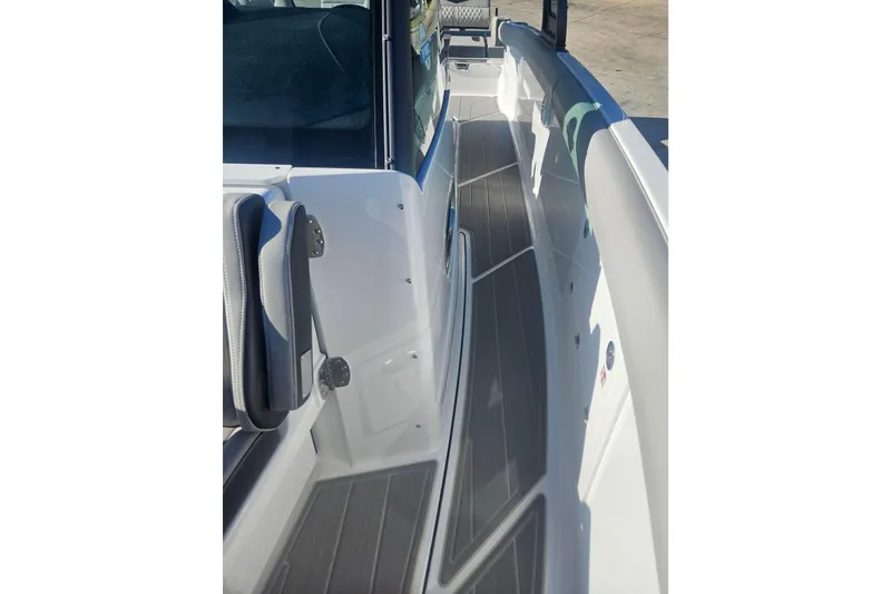 Slide: The Image of 2026 Monterey Elite 30 OB boat interior with sleek seating and modern design. - 26