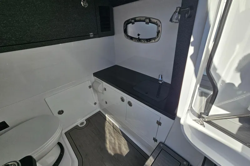 Slide: The Image of 2026 Monterey Elite 30 OB boat interior with modern bathroom amenities. - 30