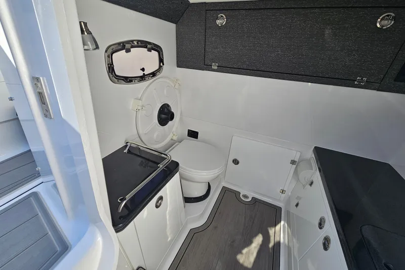 Slide: The Image of 2026 Monterey Elite 30 OB boat interior bathroom with modern fixtures and sleek design. - 31