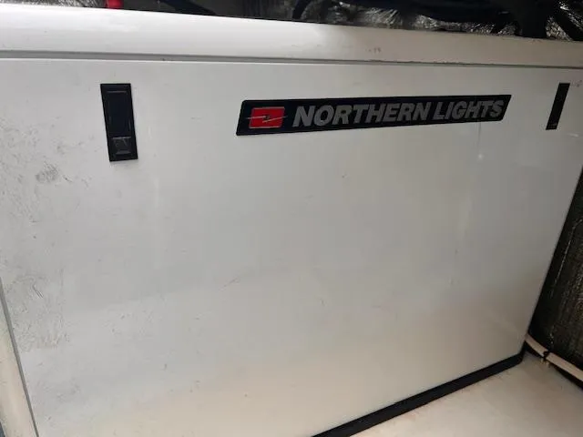 Slide: The Image of Northern Lights generator on 2004 Sea Sport Voyager 3000 boat. - 25