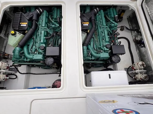 Slide: The Image of Twin engines in a 2004 Sea Sport Voyager 3000 boat engine compartment. - 29