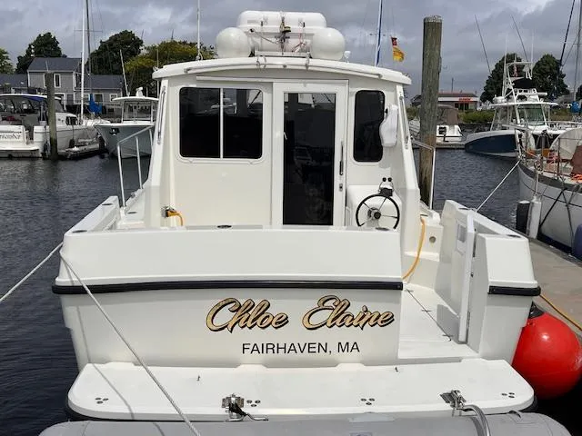 Slide: The Image of 2004 Sea Sport Voyager 3000 boat docked in Fairhaven, MA marina. - 3