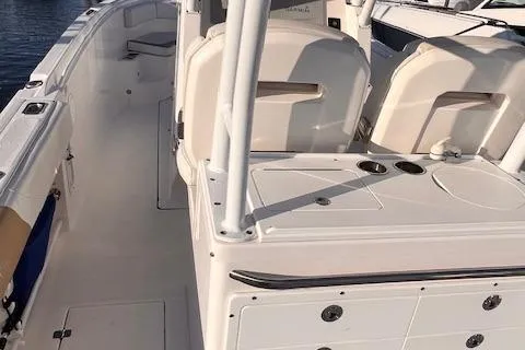 Slide: The Image of 2015 Edgewater 280CC boat interior with seating and storage compartments. - 6