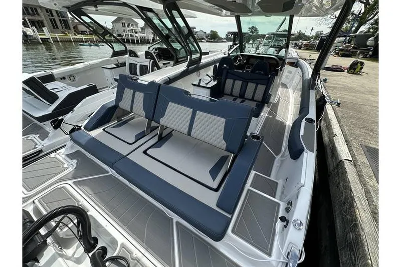 Slide: The Image of 2026 Monterey Elite 30 OB luxury boat interior with stylish seating and modern design. - 3