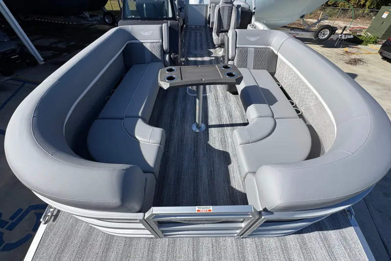 Slide: The Image of 2026 Bennington 24 MFB pontoon boat with spacious gray seating and central table. - 17