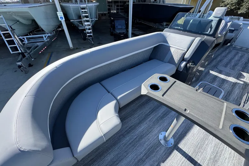 Slide: The Image of Luxurious seating area on 2026 Bennington 24 MFB pontoon boat with cup holders and modern design. - 20
