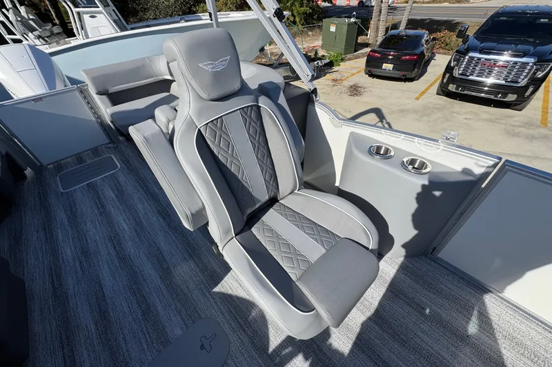 Slide: The Image of 2026 Bennington 24 MFB boat interior with luxurious seating and cup holders. - 28