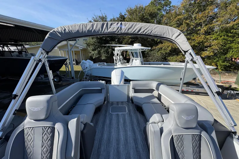 Slide: The Image of 2026 Bennington 24 MFB pontoon boat with luxurious gray seating and canopy. - 31