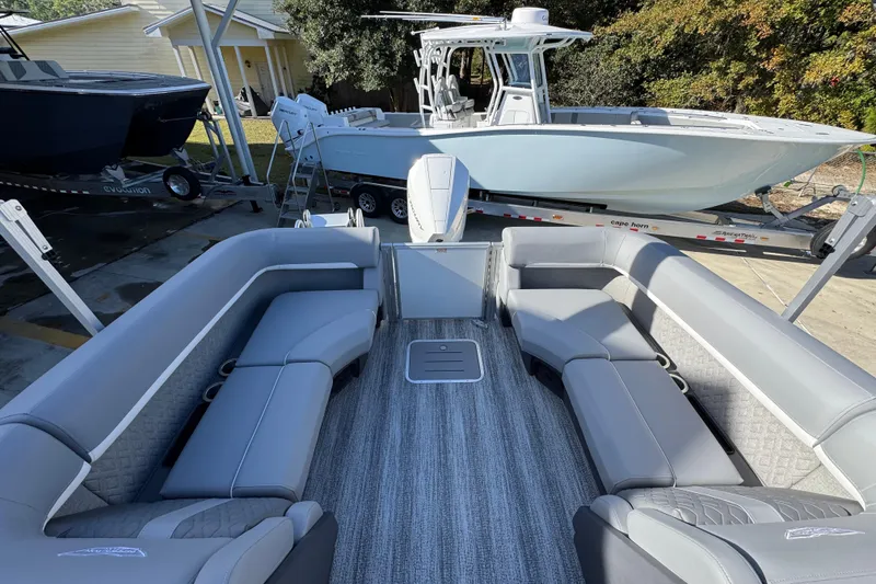 Slide: The Image of 2026 Bennington 24 MFB pontoon boat with spacious seating and modern design. - 32