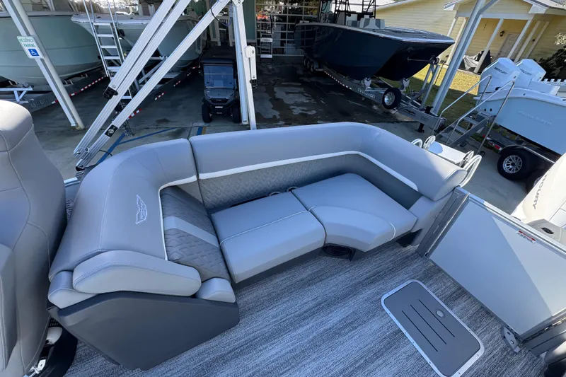 Slide: The Image of Luxurious seating on 2026 Bennington 24 MFB pontoon boat, featuring sleek gray upholstery. - 33