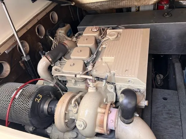 Slide: The Image of Engine compartment of a 2001 Carolina Classic 28 boat, showcasing detailed mechanical components. - 14