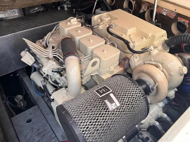 Slide: The Image of Engine compartment of a 2001 Carolina Classic 28 boat, showcasing detailed mechanical components. - 15