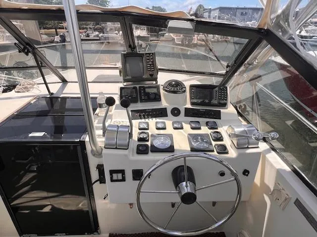 Slide: The Image of Helm of a 2001 Carolina Classic 28 boat with navigation instruments. - 2