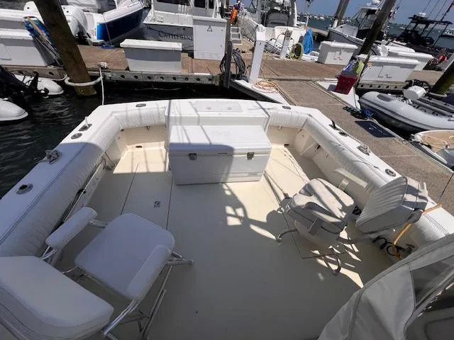 Slide: The Image of 2001 Carolina Classic 28 boat with spacious deck at marina. - 7