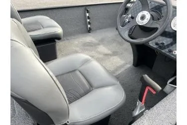 Slide: The Image of 2021 Bass Tracker Classic boat interior with gray seats and steering wheel. - 10