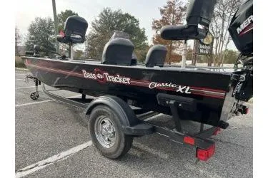 Slide: The Image of 2021 Bass Tracker Classic XL boat on trailer in parking lot. - 2