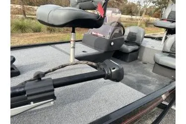 Slide: The Image of 2021 Bass Tracker Classic boat interior with seating and trolling motor. - 6