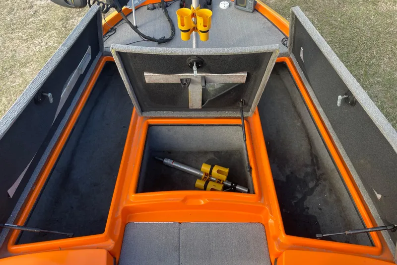 Slide: The Image of 2008 Nitro Z-7 boat interior with open storage compartments and equipment. - 11