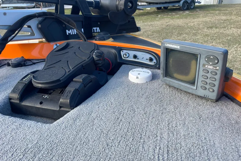 Slide: The Image of 2008 Nitro Z-7 boat dashboard with Lowrance X96TX fishfinder and Minn Kota trolling motor. - 13
