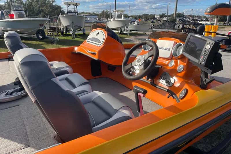 Slide: The Image of 2008 Nitro Z-7 boat interior with orange dashboard and steering wheel. - 5