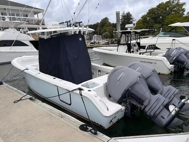 Slide: The Image of 2015 Sea Hunt Gamefish 25 boat docked with twin outboard engines. - 3