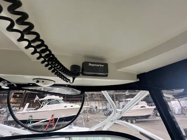 Slide: The Image of Interior view of a 2005 Hydra-Sports 2500 VX boat with Raymarine equipment. - 10