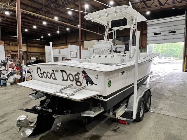 Slide: The Image of 1997 Silverhawk 24 CC boat named "Good Dog" in a warehouse on a trailer. - 4