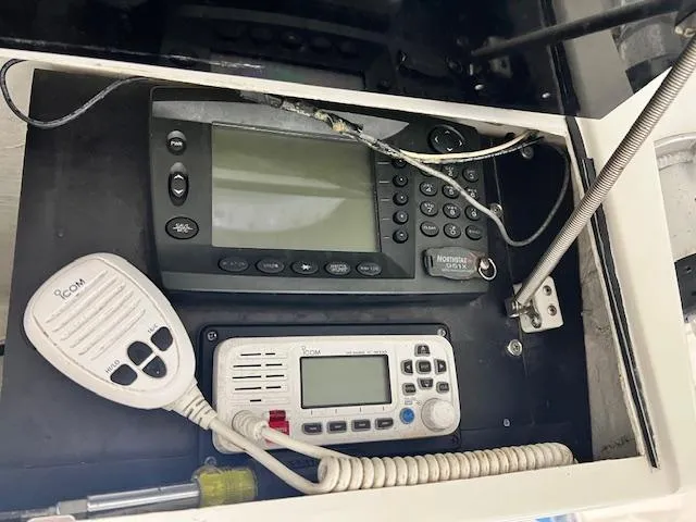 Slide: The Image of Electronics panel on a 1997 Silverhawk 24 CC boat, featuring communication devices. - 6
