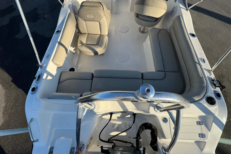 Slide: The Image of Interior view of a 2021 Key West 203 DFS boat with beige seating. - 13