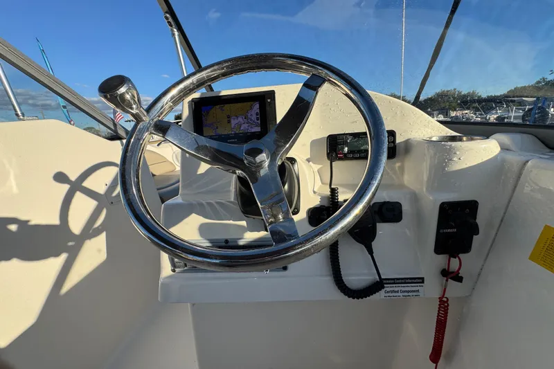 Slide: The Image of Steering console of 2021 Key West 203 DFS boat with navigation equipment. - 22