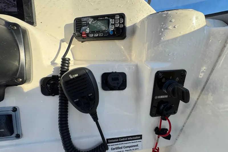 Slide: The Image of Control panel of a 2021 Key West 203 DFS boat with Icom radio and Yamaha controls. - 25