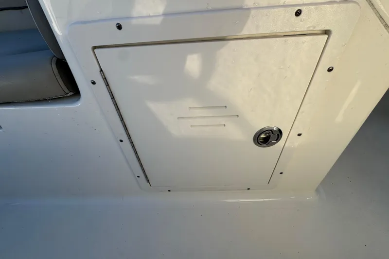 Slide: The Image of Key West 203 DFS 2021 boat storage compartment with lock, white finish. - 29