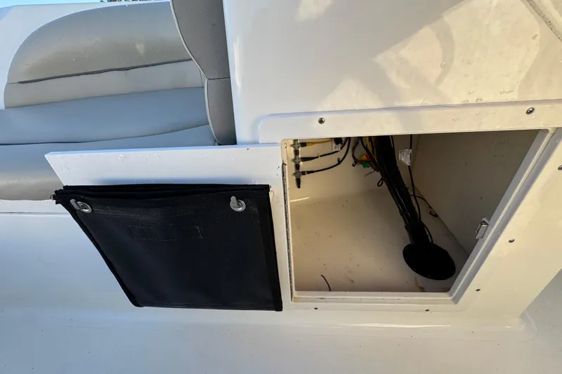 Slide: The Image of Open storage compartment on 2021 Key West 203 DFS boat with visible wiring. - 30