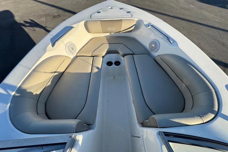 Slide: The Image of 2021 Key West 203 DFS boat interior with cushioned seating and cup holders. - 32