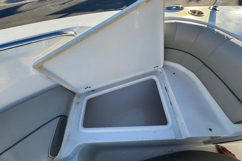 Slide: The Image of Open storage compartment on a 2021 Key West 203 DFS boat. - 36