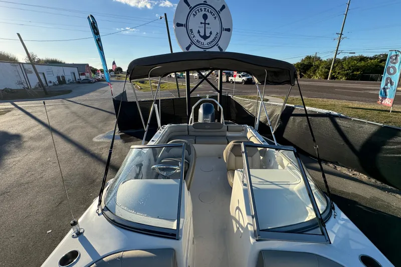 Slide: The Image of 2021 Key West 203 DFS boat with canopy, parked outdoors under clear sky. - 42