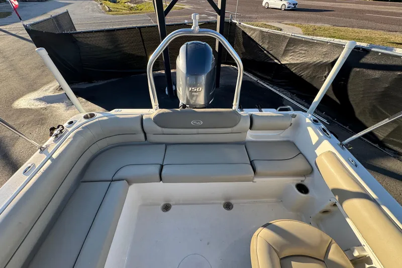 Slide: The Image of 2021 Key West 203 DFS boat interior with seating and outboard motor. - 48