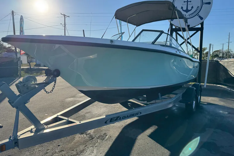 Slide: The Image of 2021 Key West 203 DFS boat on trailer under sunny sky. - 5