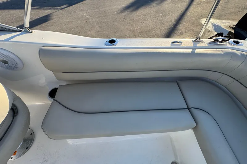 Slide: The Image of 2021 Key West 203 DFS boat interior with cushioned seating and speaker. - 52