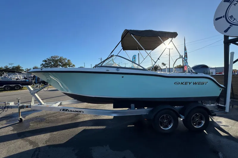 Slide: The Image of 2021 Key West 203 DFS boat on trailer, sunny day, outdoor display. - 6