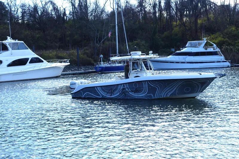 Slide: The Image of 2007 Hydra-Sports Vector 2900 CC boat on water, surrounded by other vessels. - 0