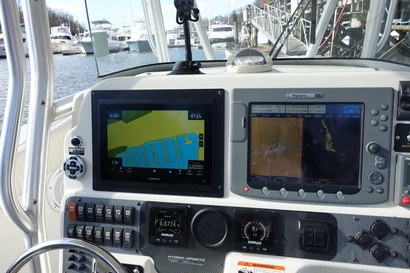 Slide: The Image of 2007 Hydra-Sports Vector 2900 CC boat dashboard with navigation and control systems. - 14