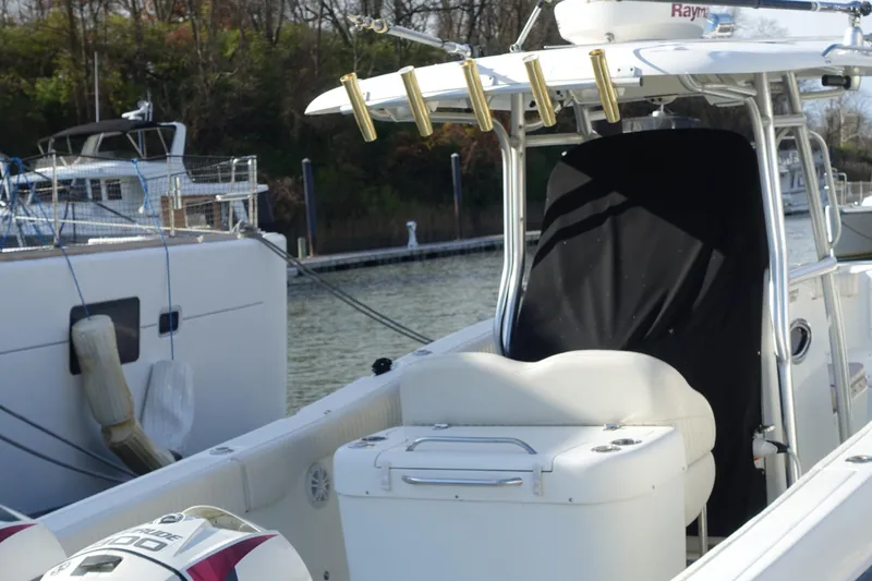 Slide: The Image of 2007 Hydra-Sports Vector 2900 CC boat docked at marina, featuring fishing rod holders. - 16