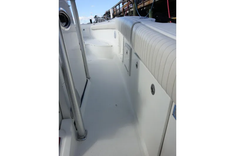 Slide: The Image of 2007 Hydra-Sports Vector 2900 CC boat interior with seating and storage, docked at marina. - 7